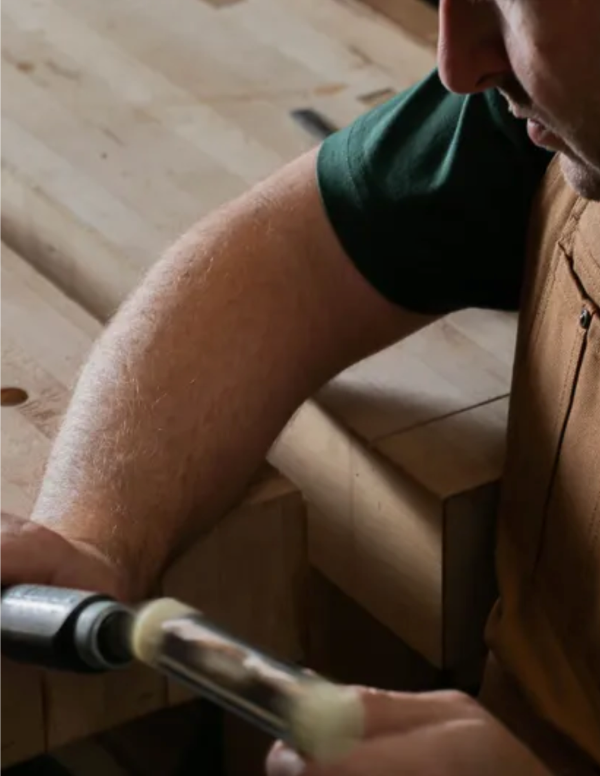 Bronx workshop studio - Chris at the cabinetmaker's workbench with a chisel